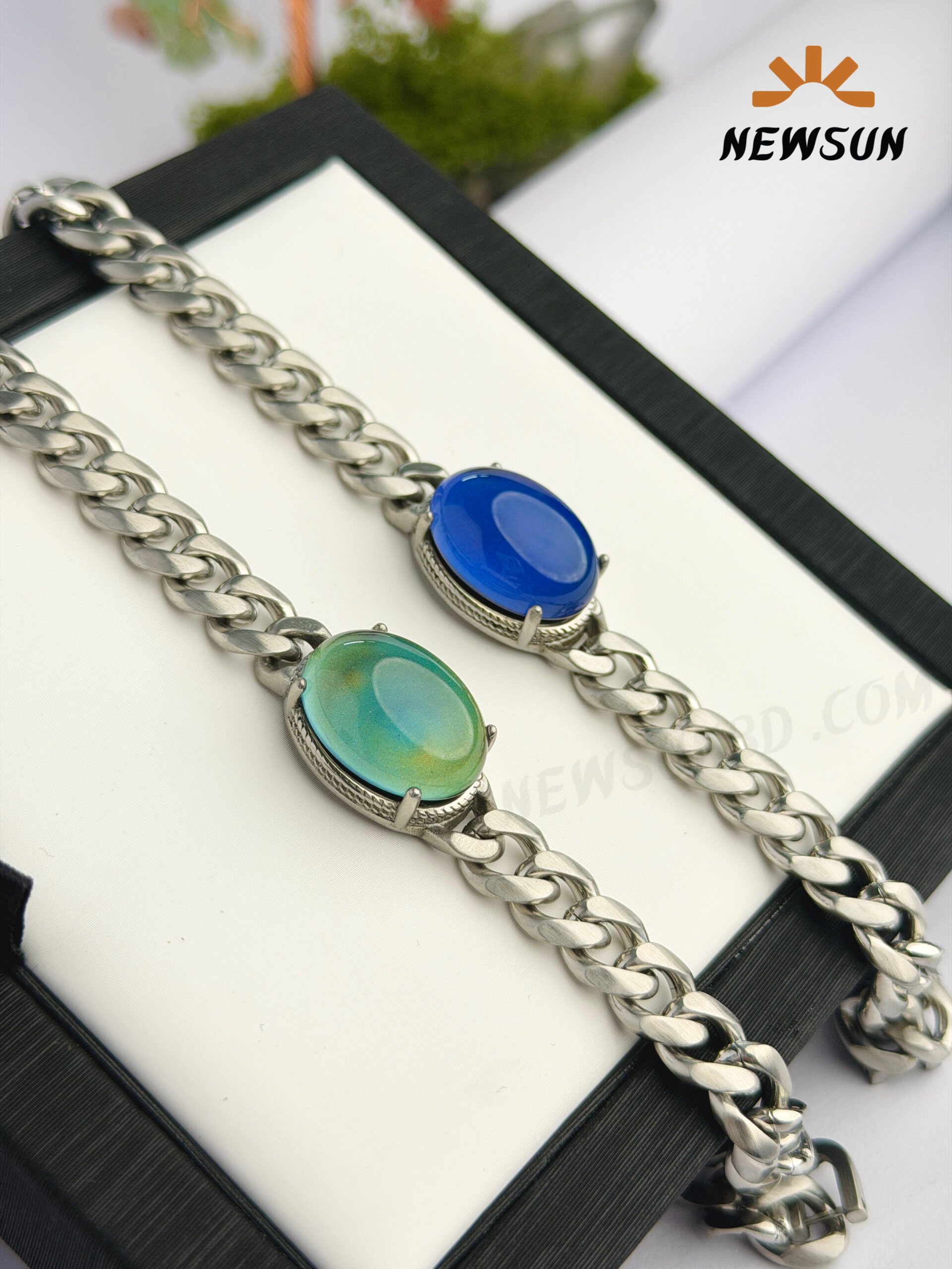 D58F0FFE-7737-43FB-BEB1-8BD021BE7928 100% Color Changing Oval Stone And Stainless Steel Bracelet - Image 1